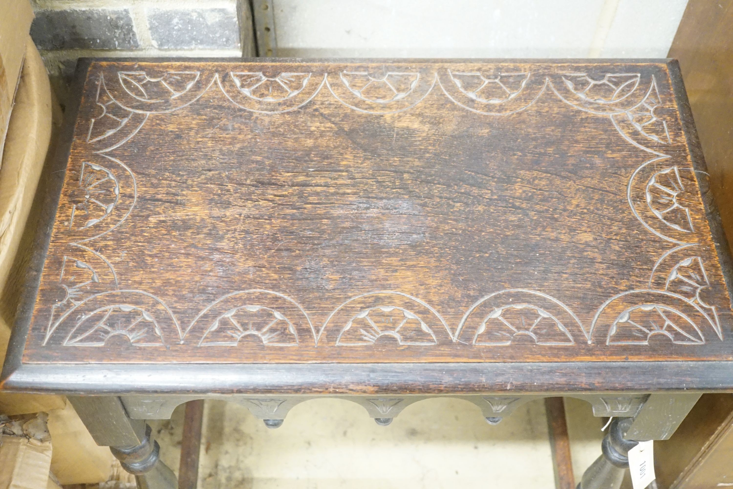 A rectangular carved oak side table, width 66cm depth 40cm height 74cm